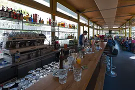 Orient Okzident, interior shot with guests and the bar 