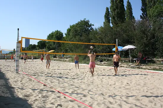 Beach volleyball players in action at the Vienna City Beach Club